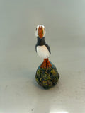Puffin on seascape cliff
