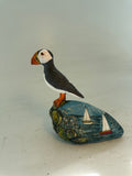 Puffin on seascape cliff