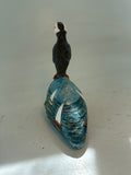 Puffin on seascape cliff