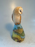 Barn owl on countryside hill